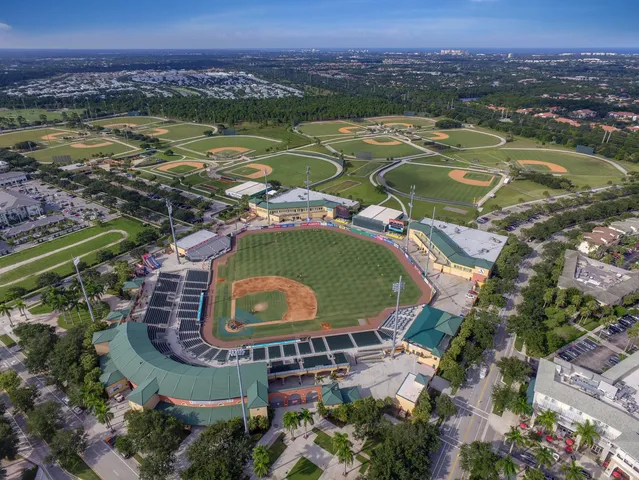 an aerial view of a house with a lake view