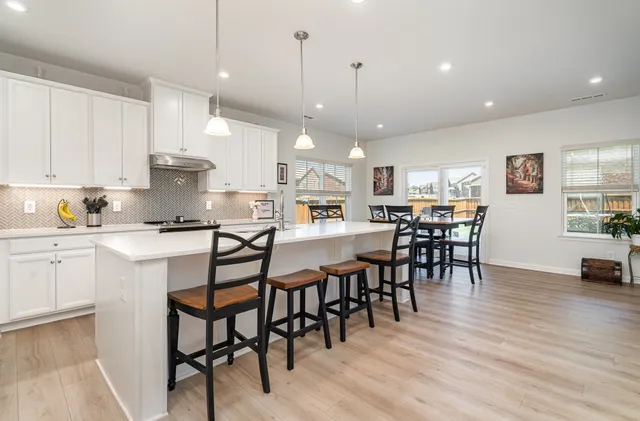 a view of a dining area with furniture and wooden floor