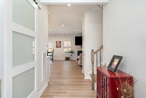 a view of living room with furniture and wooden floor