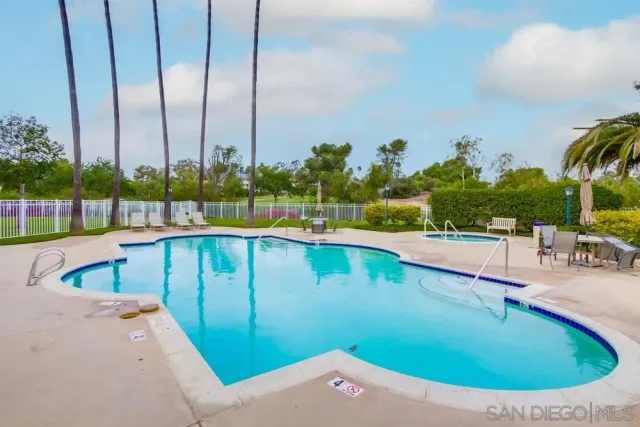 a view of swimming pool from a balcony