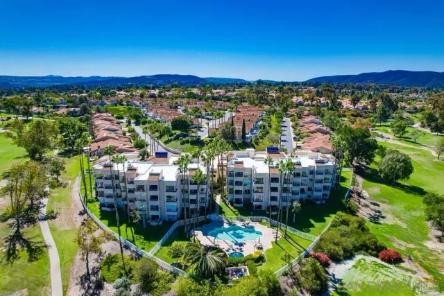 a view of a city with mountains in the background