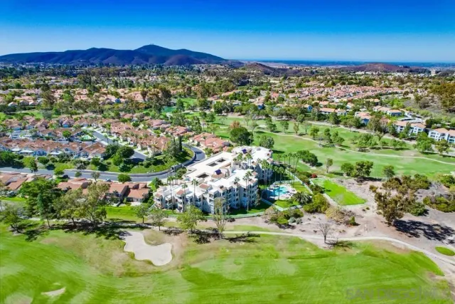 a front view of house with a yard and a garage