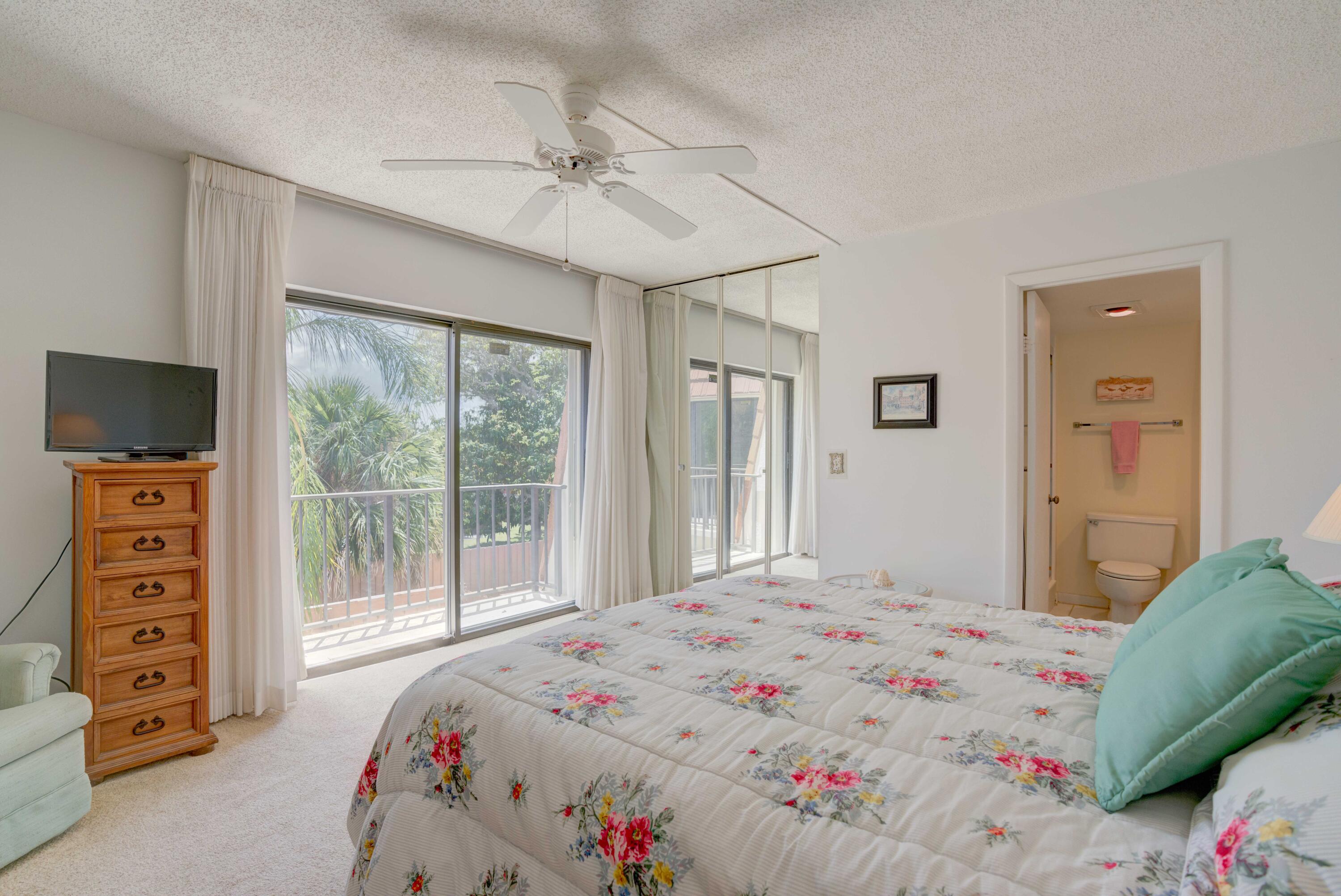 3900 County Line Road, Unit 1C Tequesta, FL 33469 - Photo 20 of 30 Primary bedroom and balcony