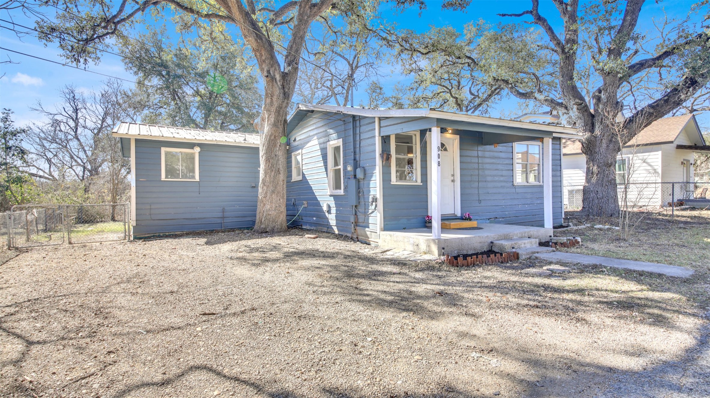 908 Tank Street Lockhart, TX 78644 - Photo 1 of 22 a view of a house with a yard covered in snow