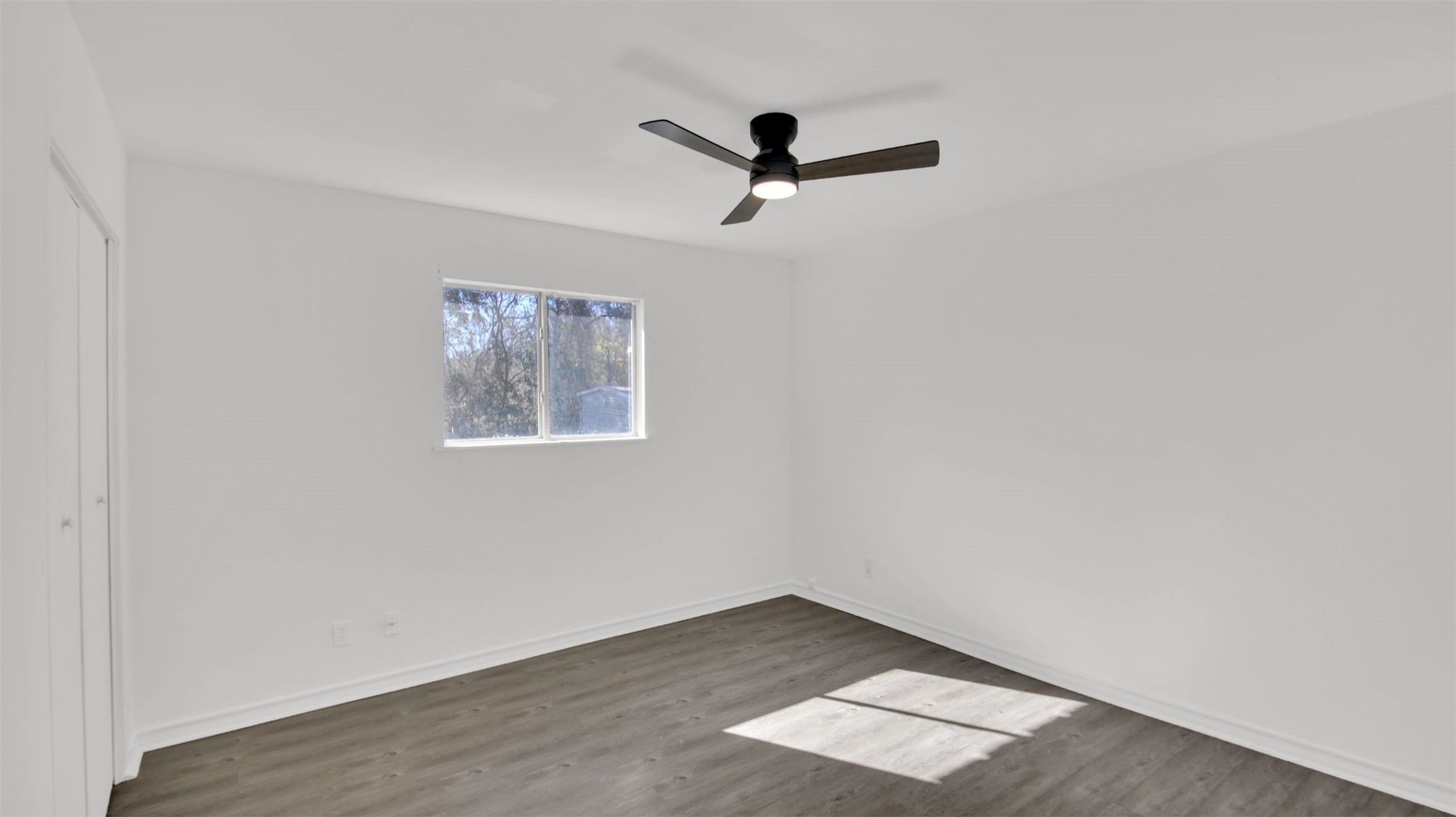 908 Tank Street Lockhart, TX 78644 - Photo 11 of 22 an empty room with a window