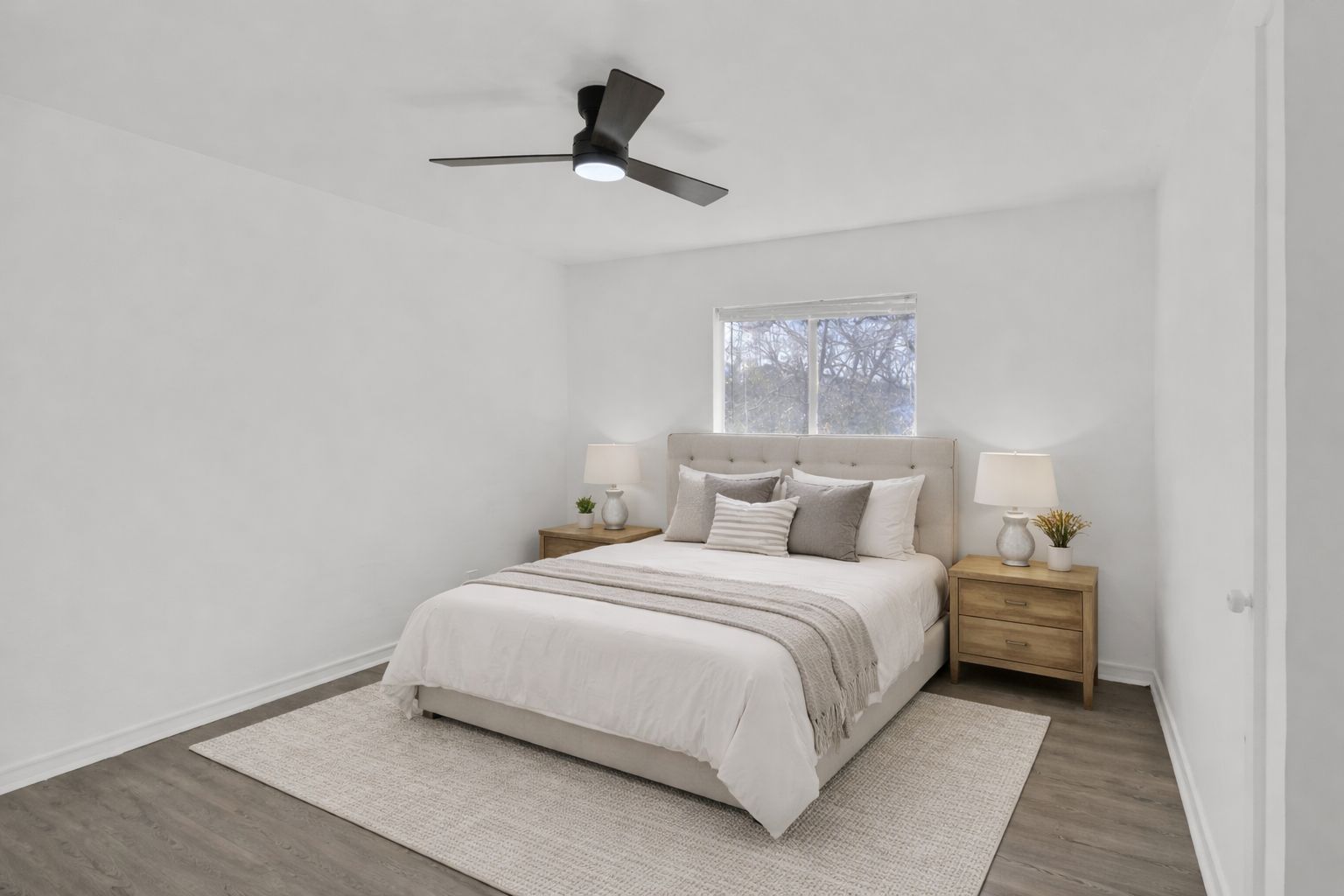 908 Tank Street Lockhart, TX 78644 - Photo 12 of 22 a bedroom with a bed and a painting on the wall