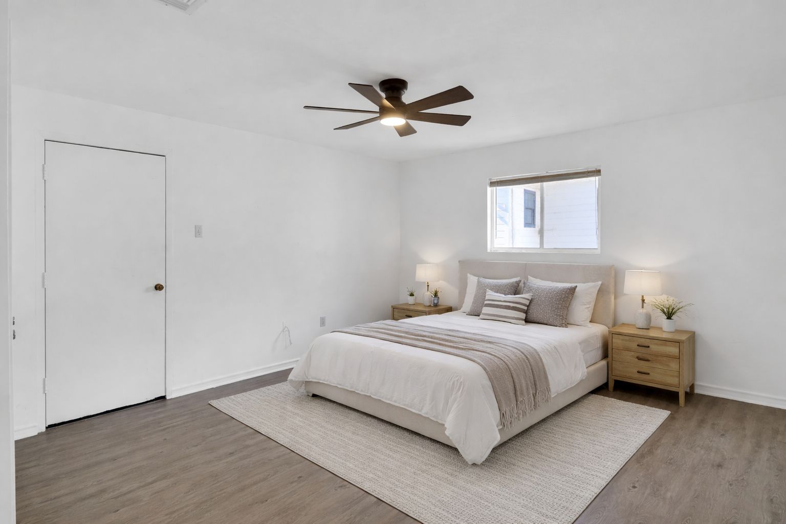 908 Tank Street Lockhart, TX 78644 - Photo 14 of 22 a bedroom with a bed and a window
