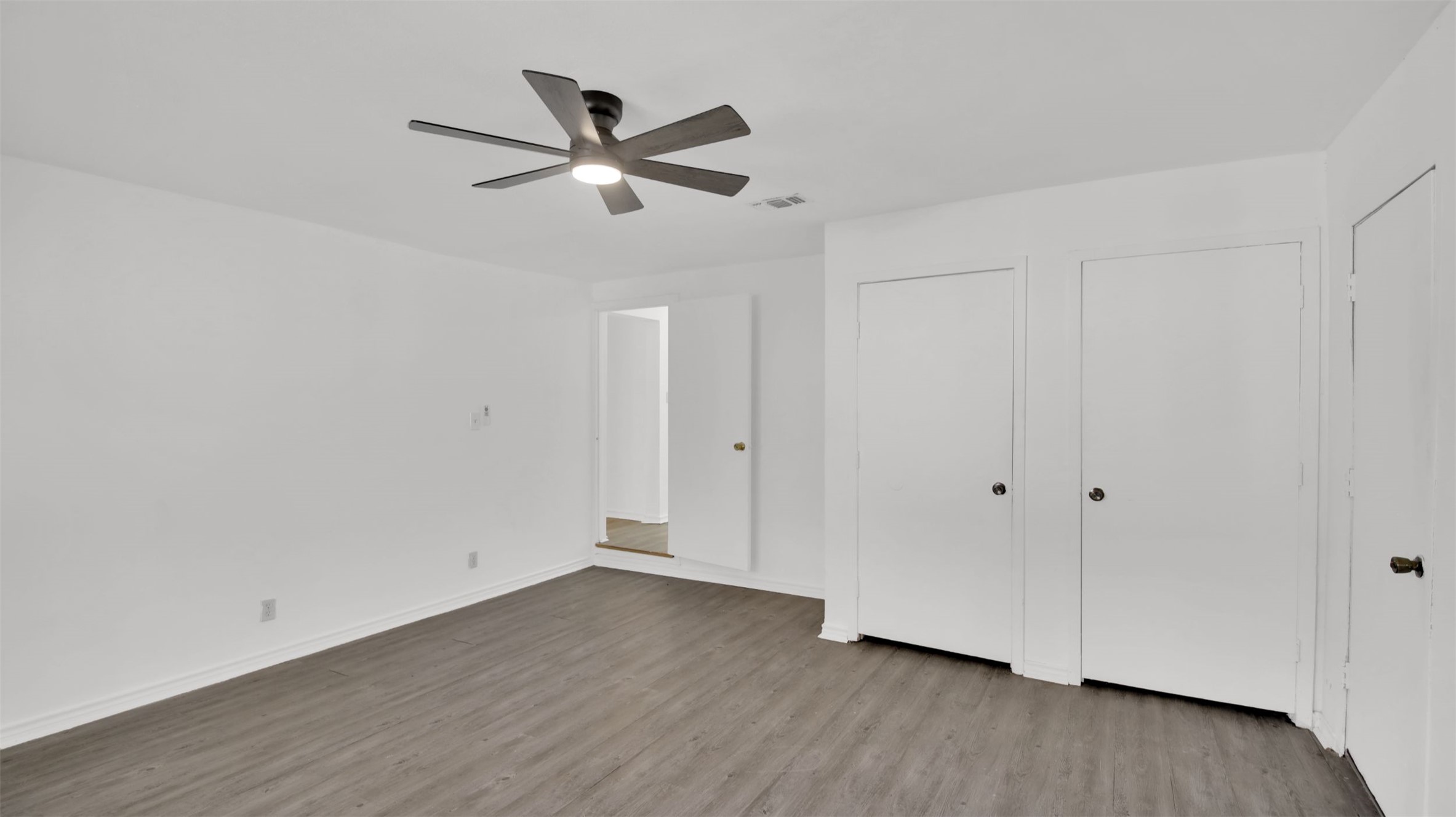 908 Tank Street Lockhart, TX 78644 - Photo 15 of 22 wooden floor in an empty room