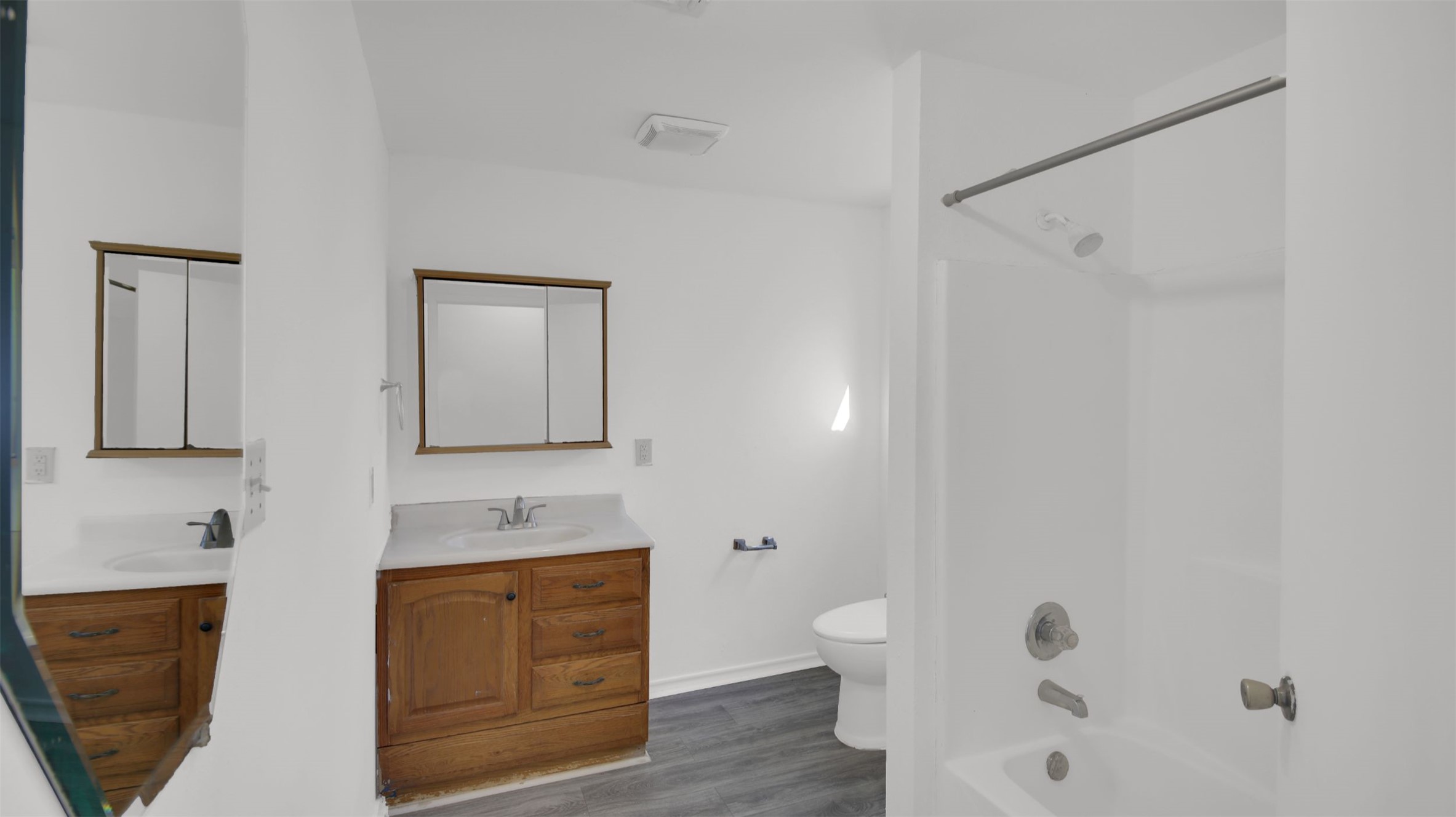 908 Tank Street Lockhart, TX 78644 - Photo 16 of 22 a bathroom with a granite countertop sink a toilet and shower
