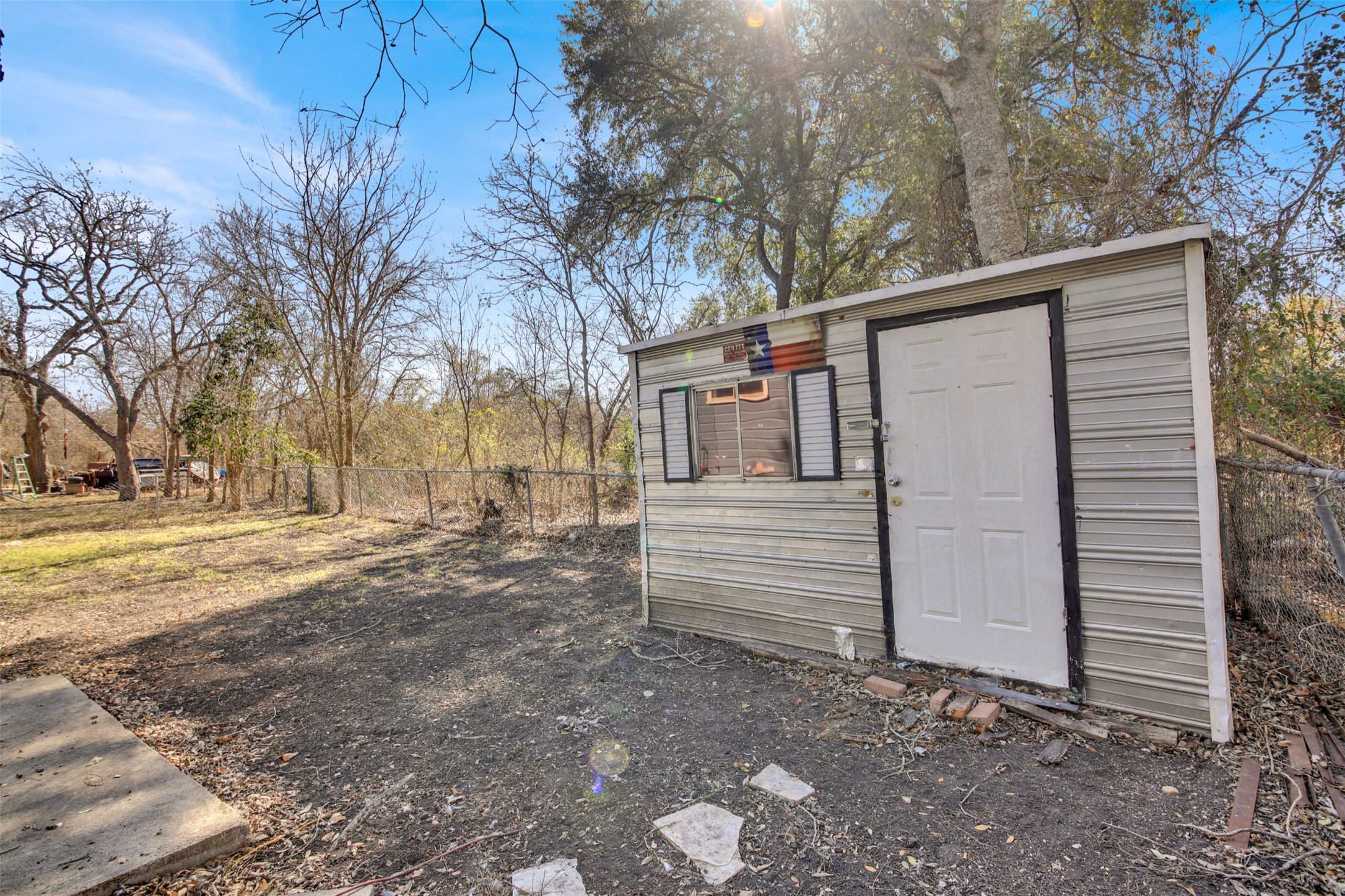 908 Tank Street Lockhart, TX 78644 - Photo 19 of 22 a view of a house with a yard