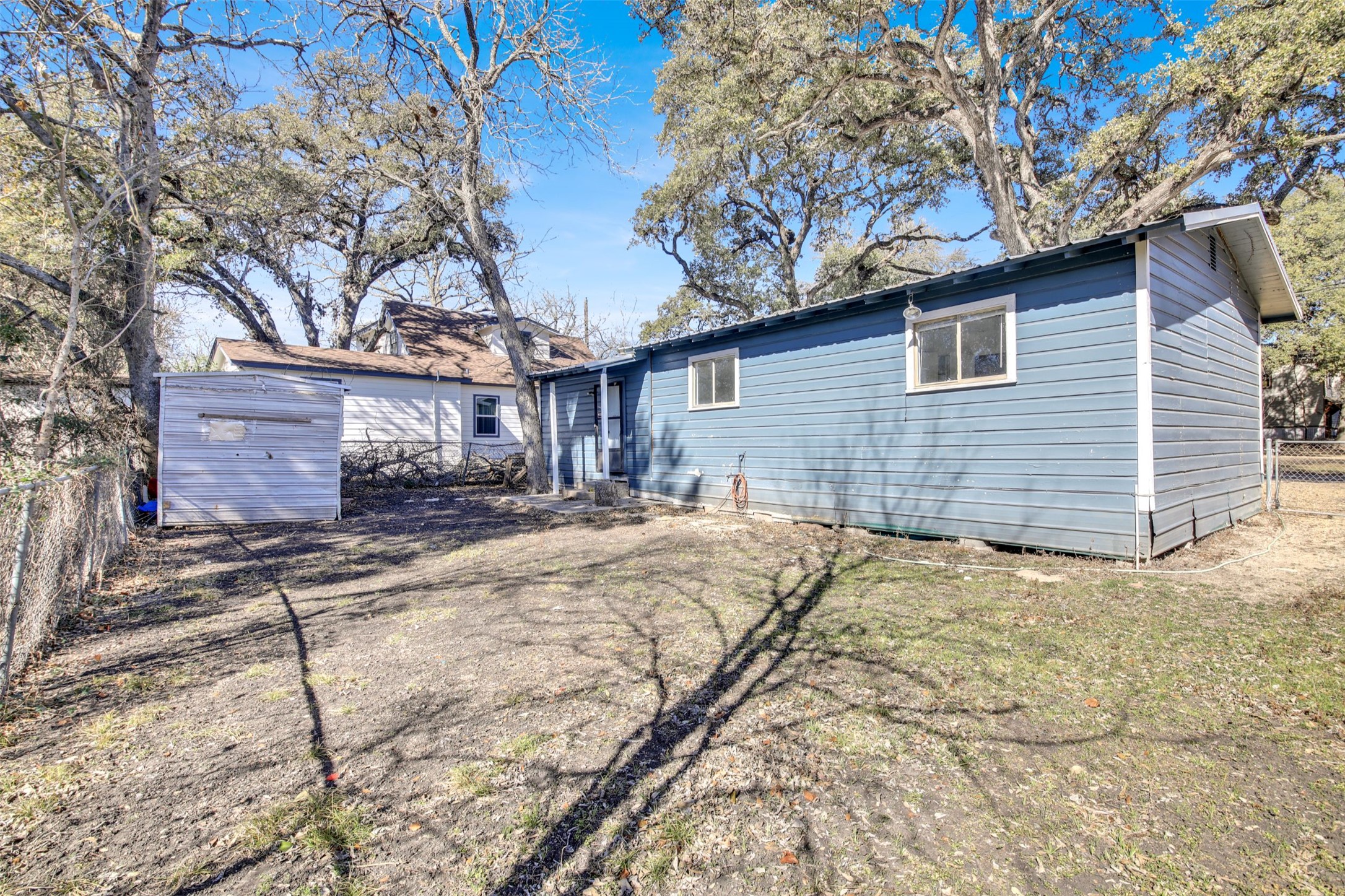 908 Tank Street Lockhart, TX 78644 - Photo 20 of 22 a view of a house with a yard