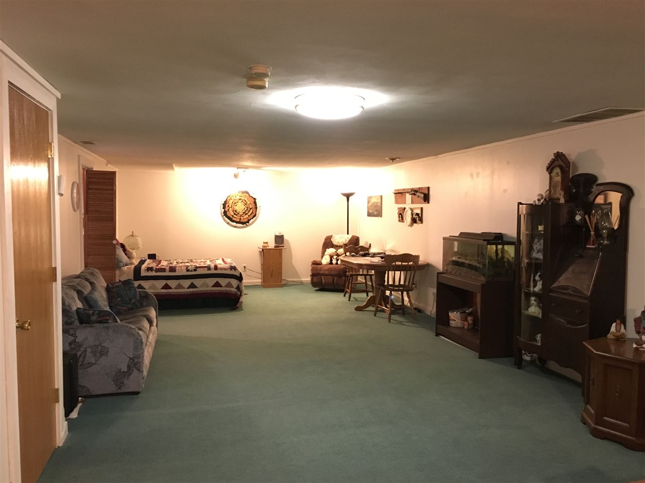 3289 North Trainer Road Rockford, IL 61114 - Photo 16 of 19 a living room with furniture and a flat screen tv