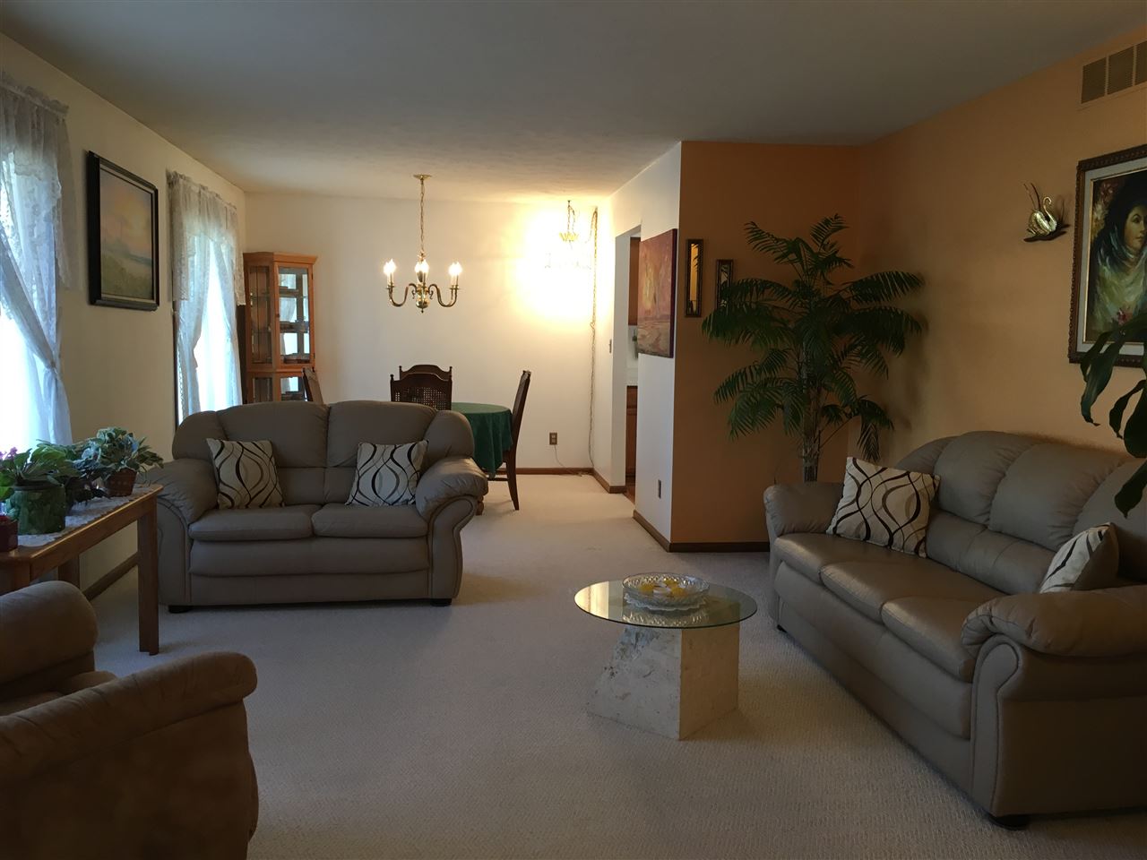 3289 North Trainer Road Rockford, IL 61114 - Photo 2 of 19 a living room with furniture and a gym machine