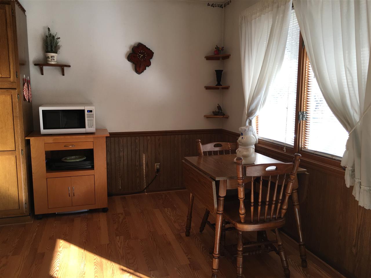 3289 North Trainer Road Rockford, IL 61114 - Photo 6 of 19 a view of a dining room with furniture and a fireplace