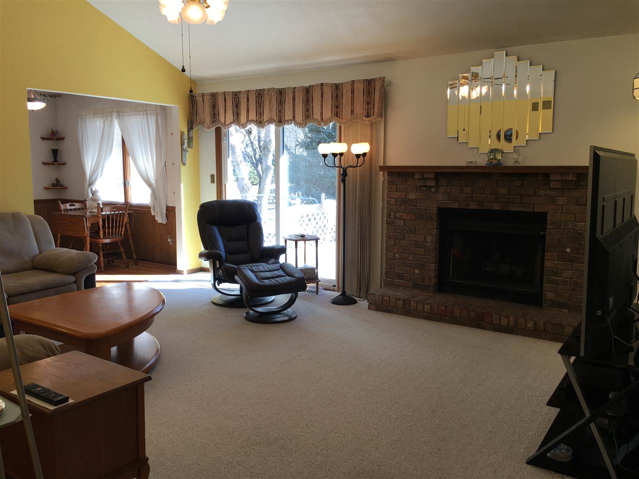 3289 North Trainer Road Rockford, IL 61114 - Photo 7 of 19 a living room with furniture and a fireplace