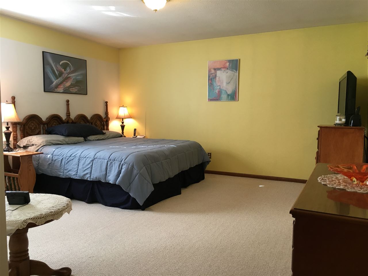 3289 North Trainer Road Rockford, IL 61114 - Photo 9 of 19 a bedroom with a bed and a painting on the wall