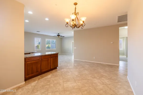 a large bathroom with a granite countertop sink a mirror and a shower