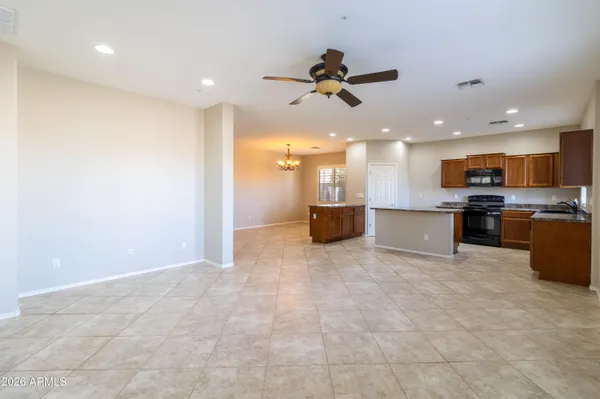 a view of a kitchen with a sink and a refrigerator