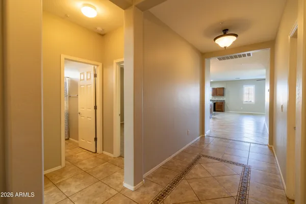 a view of a bathroom with a glass door shower and a sink