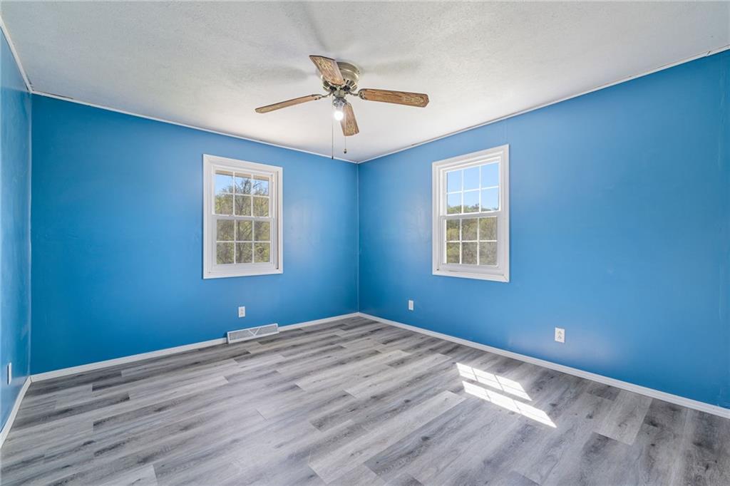 351 Pleasant Valley Road Washington, PA 15301 - Photo 16 of 41 a view of a big room with wooden floor and windows