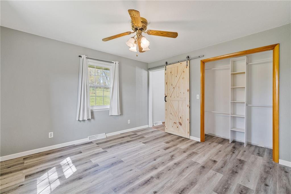 351 Pleasant Valley Road Washington, PA 15301 - Photo 19 of 41 a view of empty room with wooden floor and fan