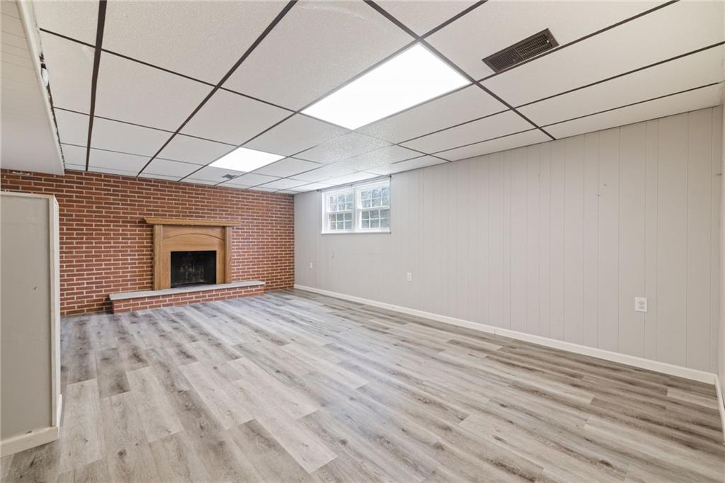 351 Pleasant Valley Road Washington, PA 15301 - Photo 23 of 41 a view of an empty room with a window and wooden floor