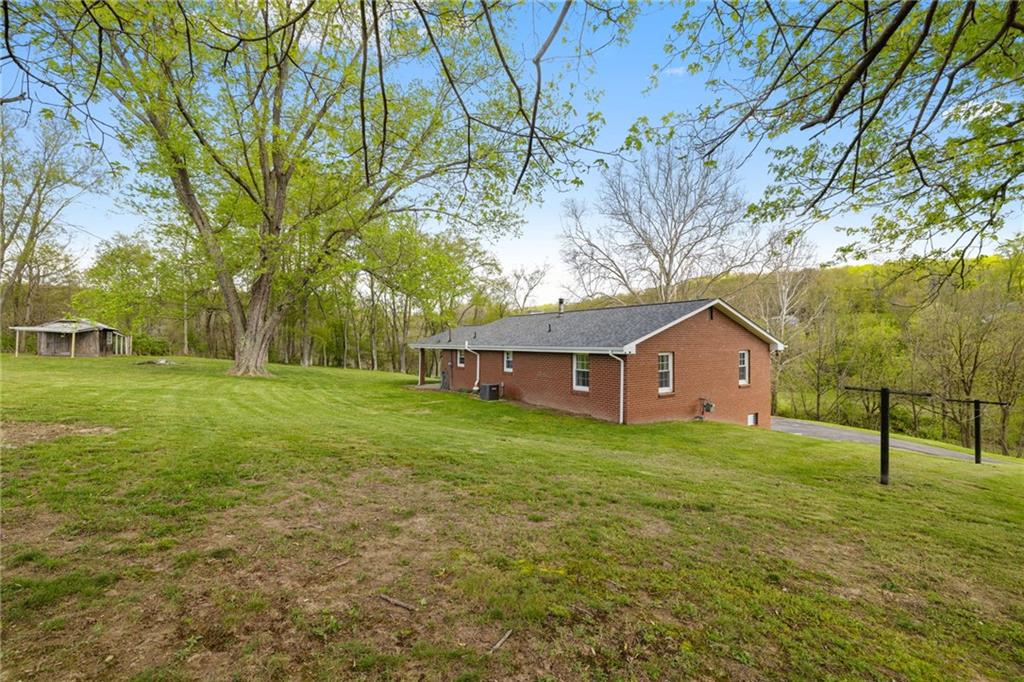 351 Pleasant Valley Road Washington, PA 15301 - Photo 35 of 41 a view of a house with a yard