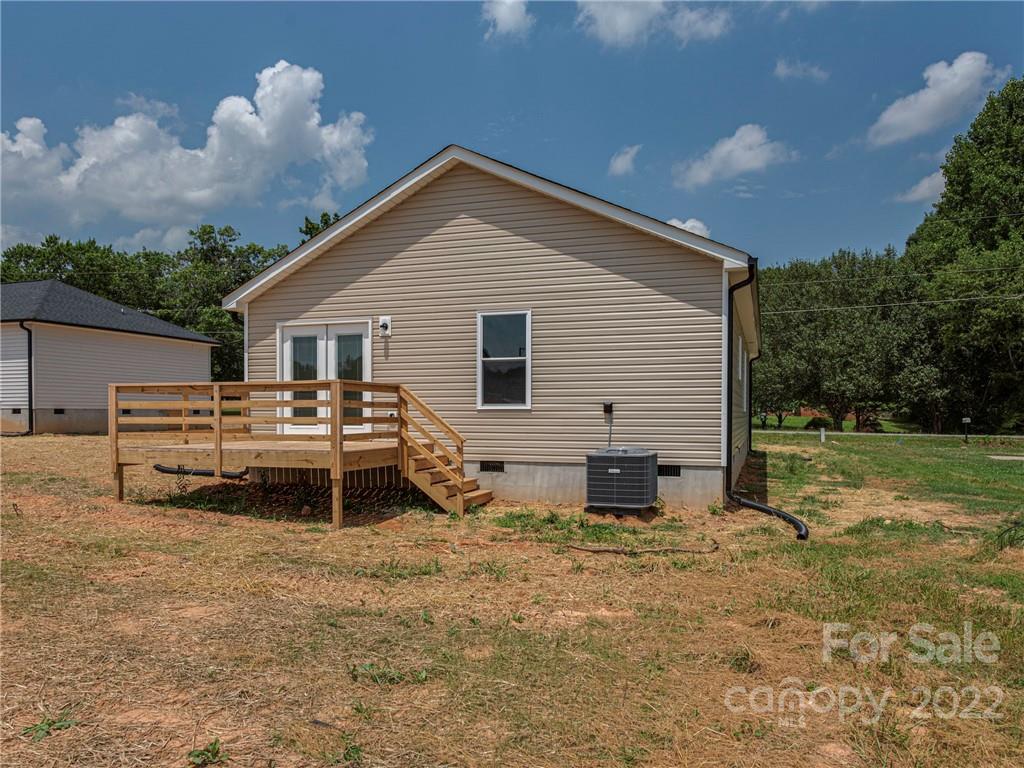 1324 Long Branch Road, Unit 2 Grover, NC 28073 - Photo 2 of 24 a backyard of a house with table and chairs