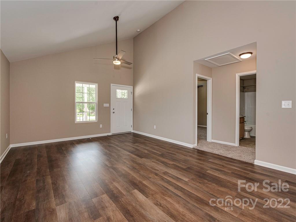 1324 Long Branch Road, Unit 2 Grover, NC 28073 - Photo 4 of 24 an empty room with wooden floor and windows