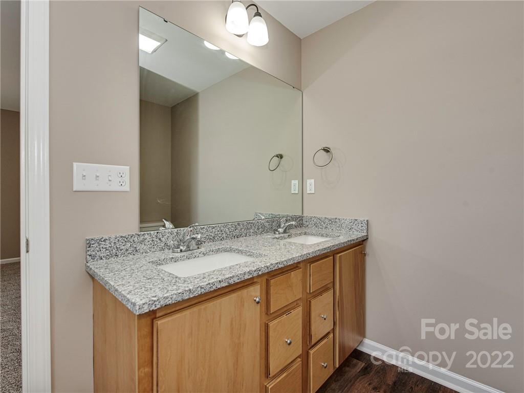 1324 Long Branch Road, Unit 2 Grover, NC 28073 - Photo 7 of 24 a bathroom with a granite countertop sink and a mirror
