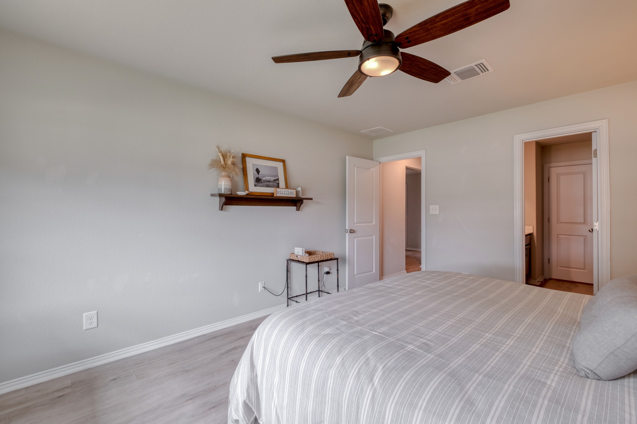 1000 Bright Star Cove Georgetown, TX 78628 - Photo 23 of 40 a bedroom with a bed and a chandelier