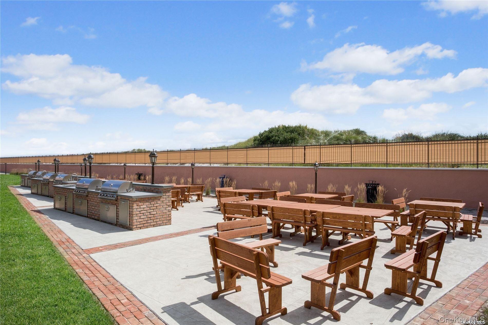 2 Richmond Road, Unit 4O Lido Beach, NY 11561 - Photo 16 of 18 a view of a terrace with couches and city view