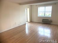 2 Richmond Road, Unit 4O Lido Beach, NY 11561 - Photo 5 of 18 an empty room with wooden floor and windows