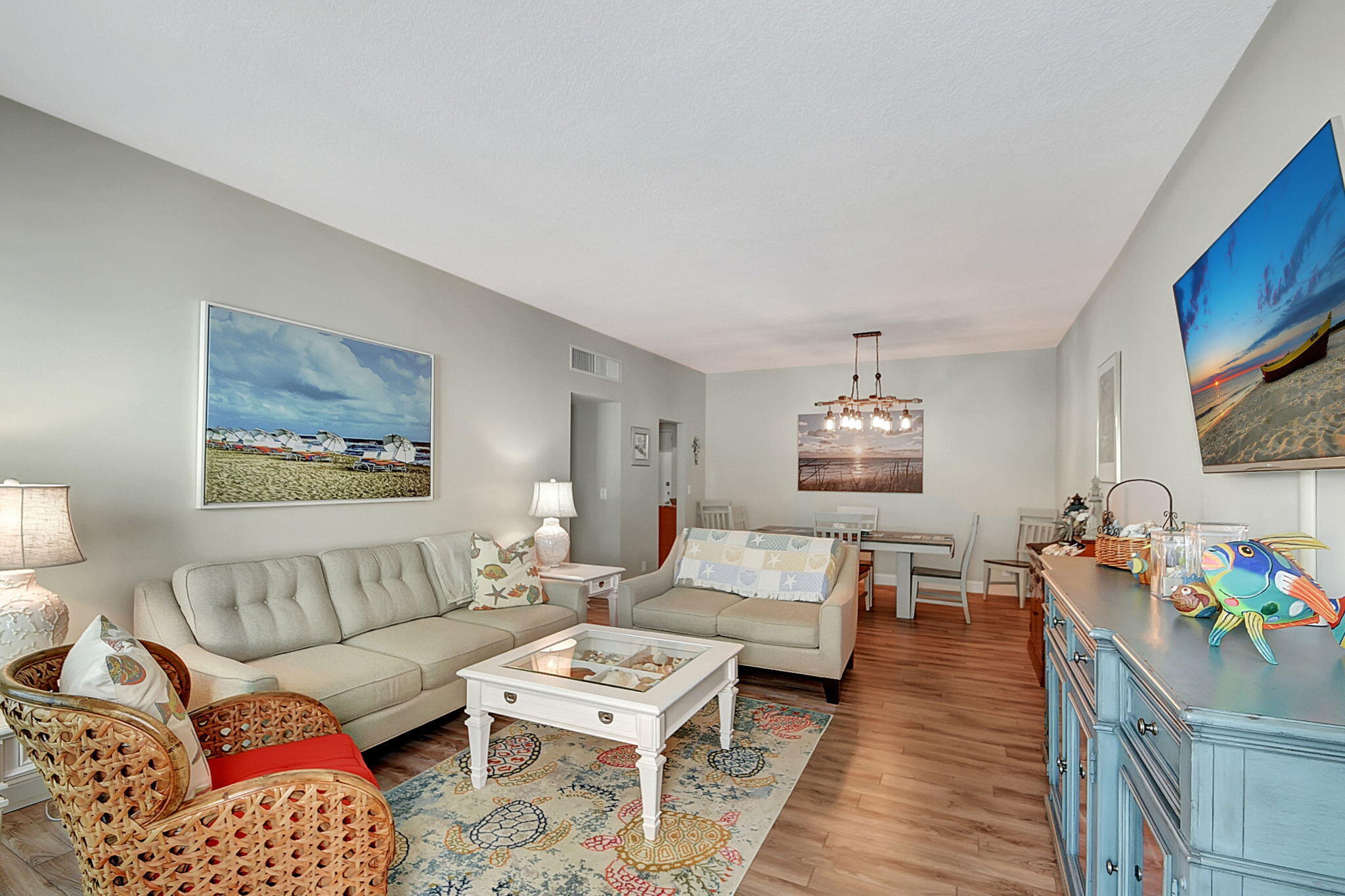 3230 South Ocean Boulevard, Unit C100 Palm Beach, FL 33480 - Photo 16 of 49 a living room with furniture and a flat screen tv