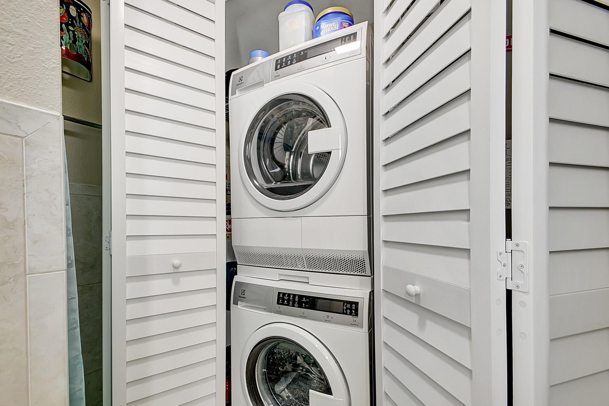 3230 South Ocean Boulevard, Unit C100 Palm Beach, FL 33480 - Photo 29 of 49 a utility room with dryer and washer