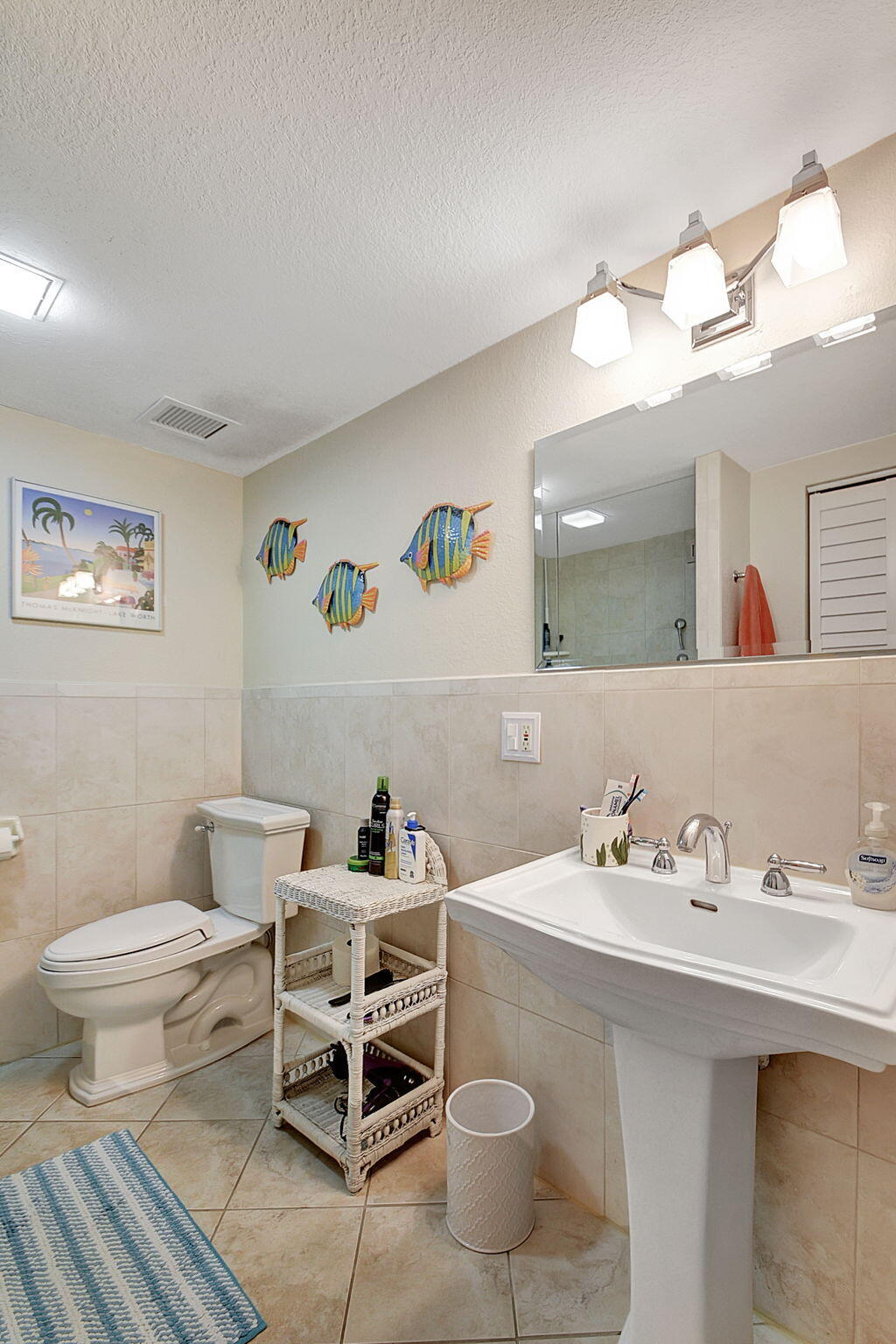 3230 South Ocean Boulevard, Unit C100 Palm Beach, FL 33480 - Photo 34 of 49 a bathroom with a sink mirror and toilet