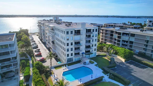 swimming pool view with a seating space