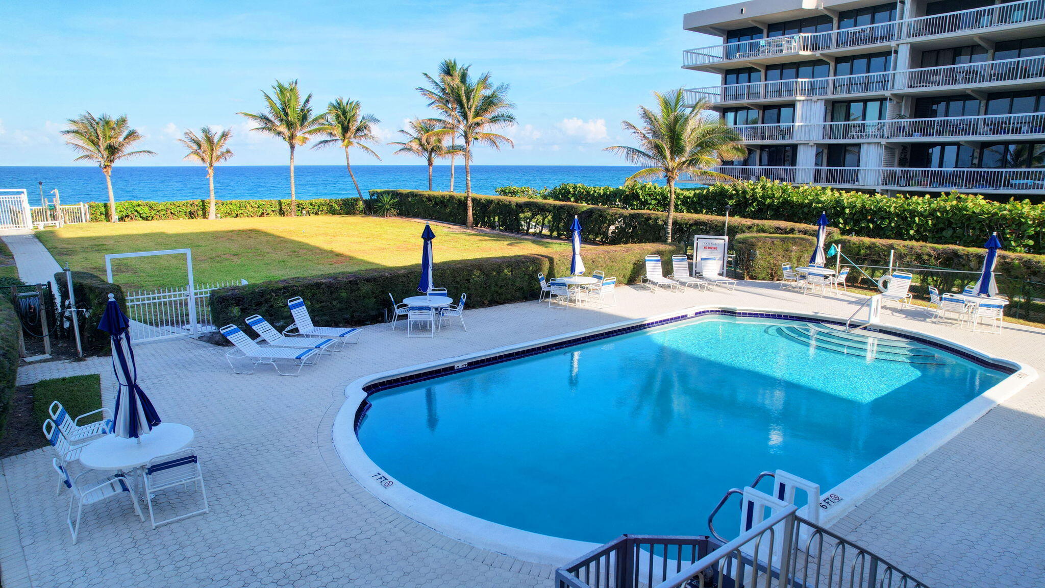 3230 South Ocean Boulevard, Unit C100 Palm Beach, FL 33480 - Photo 46 of 49 swimming pool view with a seating space