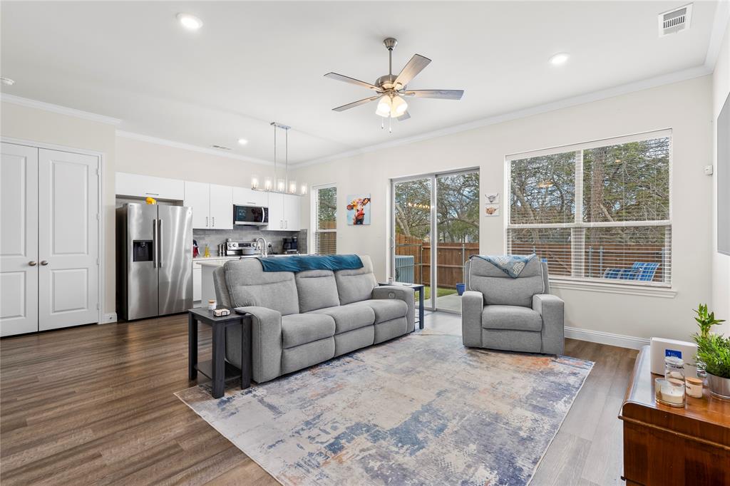 a living room with furniture and windows