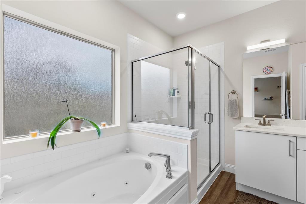 6329 Mason Court Dallas, TX 75227 - Photo 13 of 34 a bathroom with a tub sink and mirror