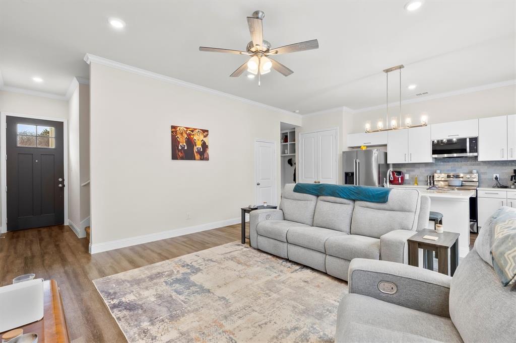 6329 Mason Court Dallas, TX 75227 - Photo 3 of 34 a living room with furniture and a flat screen tv