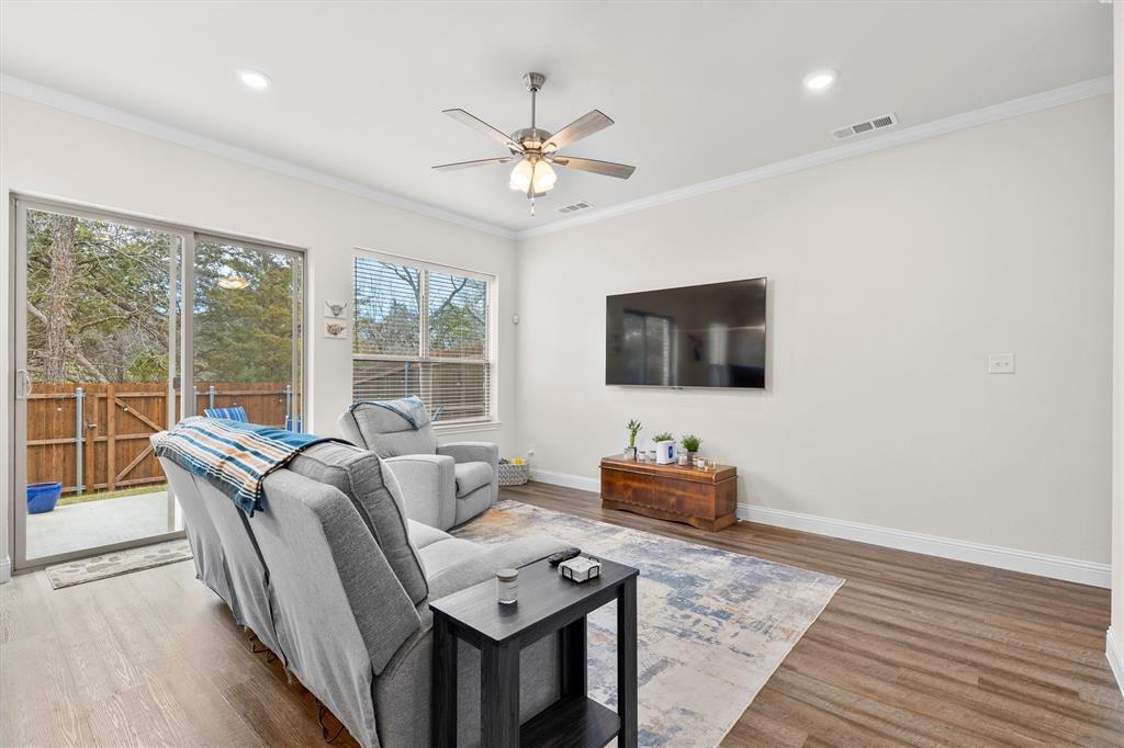 6329 Mason Court Dallas, TX 75227 - Photo 5 of 34 a living room with furniture and a flat screen tv