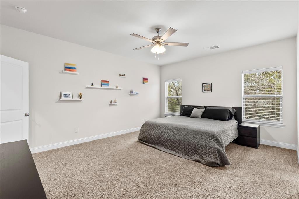 6329 Mason Court Dallas, TX 75227 - Photo 10 of 34 a bedroom with a bed and a window