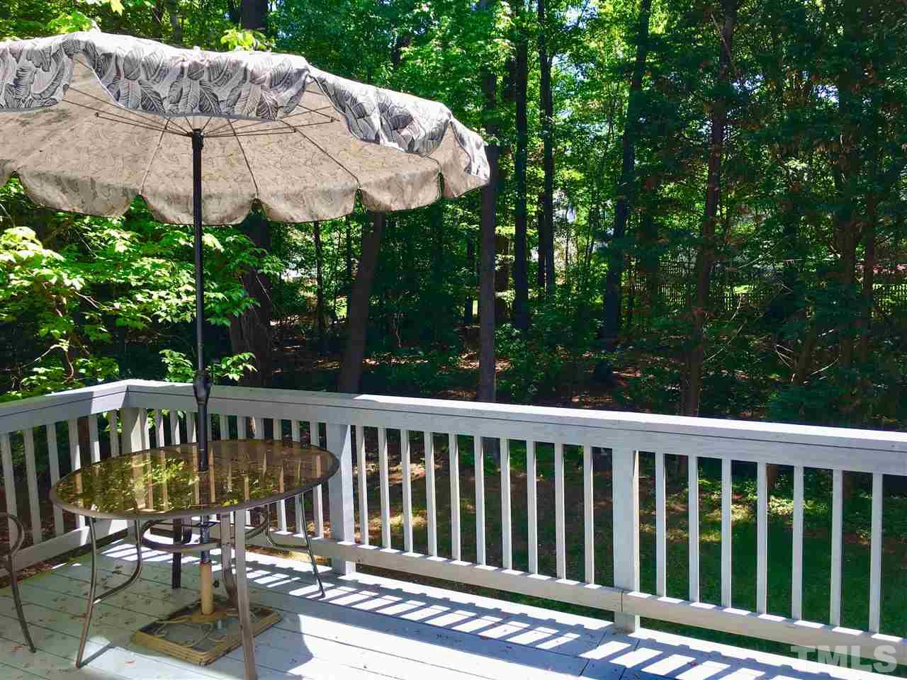 5217 Blakeley Lane Raleigh, NC 27613 - Photo 14 of 14 a view of a chair and table under an umbrella