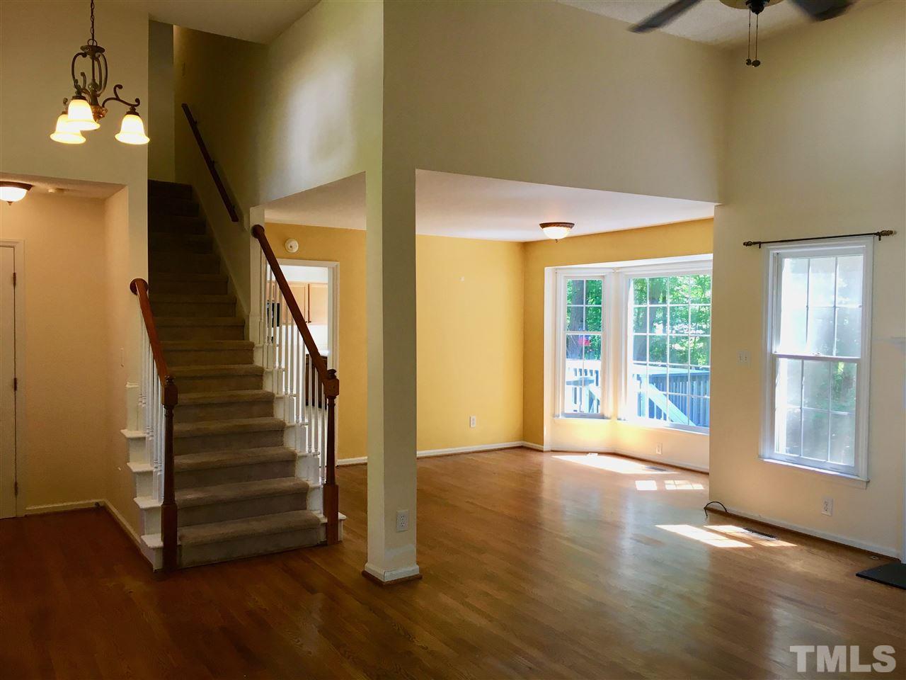 5217 Blakeley Lane Raleigh, NC 27613 - Photo 4 of 14 a view of an entryway with wooden floor and door