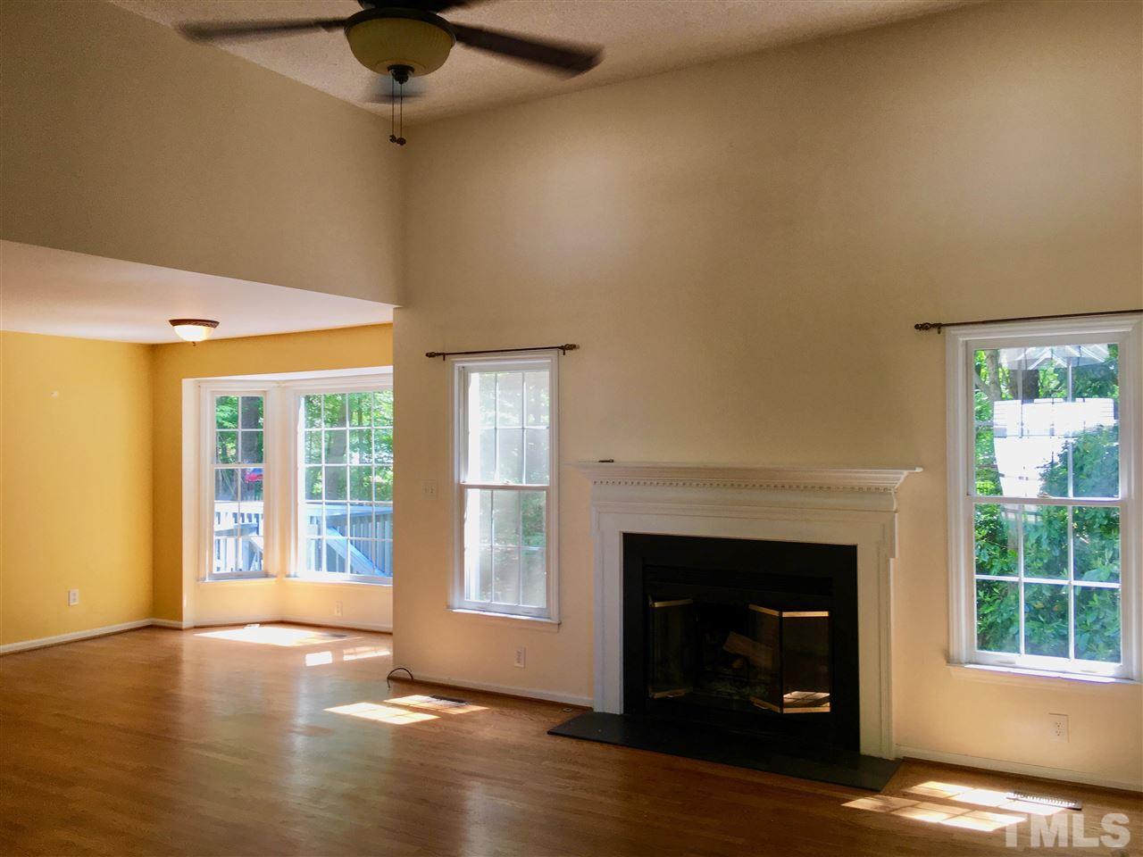 5217 Blakeley Lane Raleigh, NC 27613 - Photo 5 of 14 a view of a livingroom with a fireplace and window