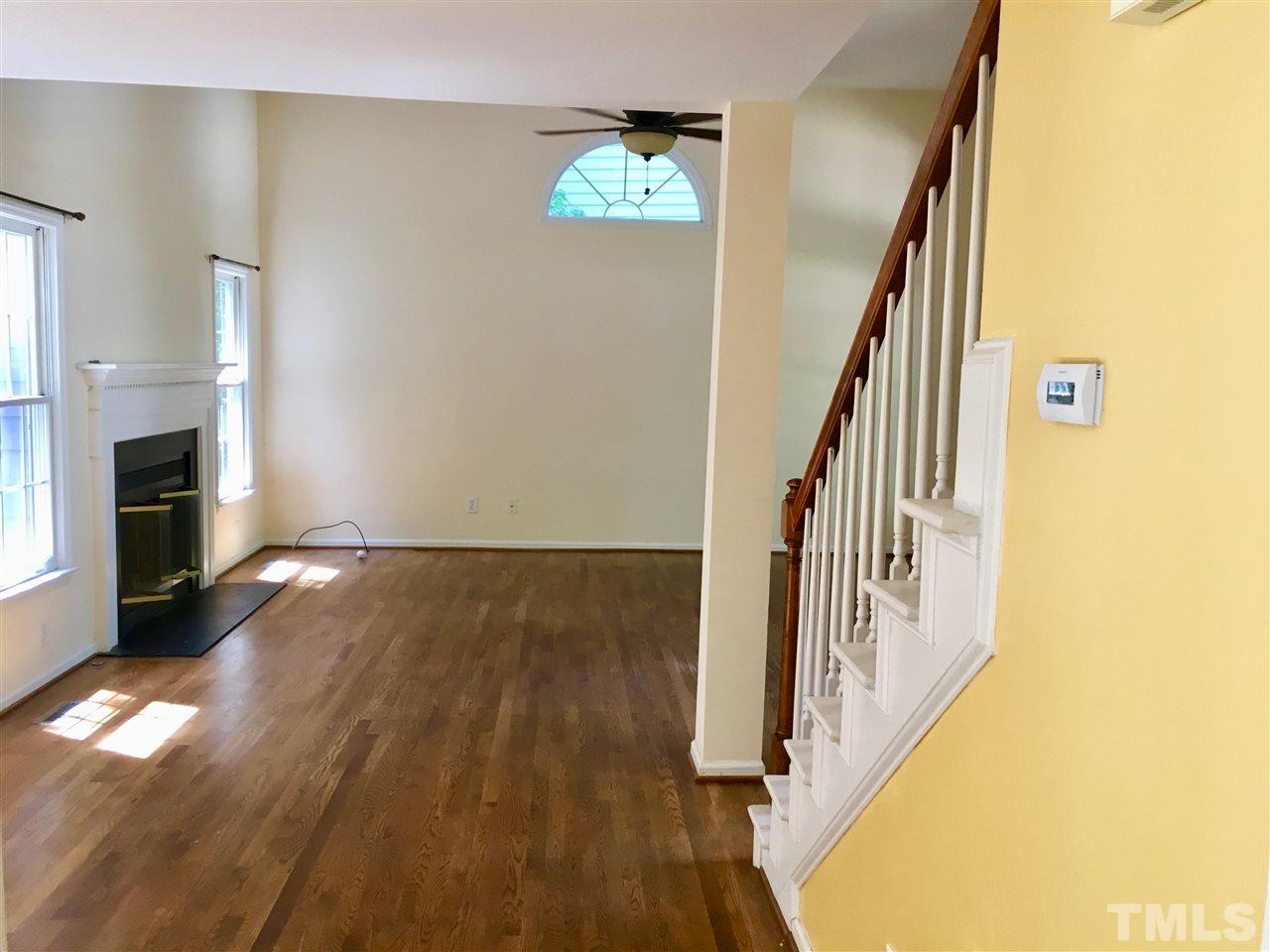 5217 Blakeley Lane Raleigh, NC 27613 - Photo 8 of 14 a view of entryway and hall with wooden floor