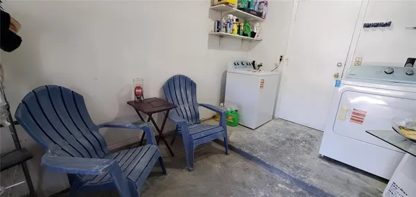 a view of a workspace with furniture