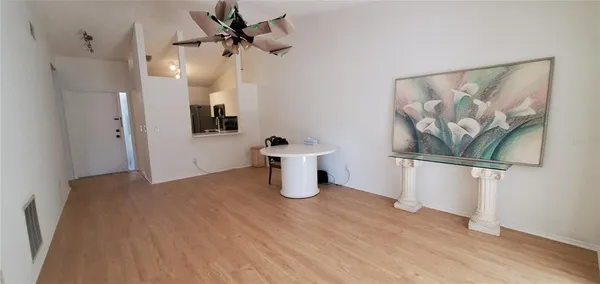 a view of an empty room with window and gallery