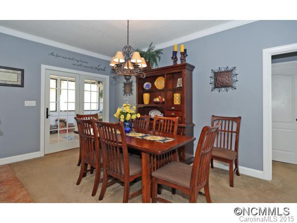 39 Hunters Trace Clyde, NC 28721 - Photo 9 of 18 a view of a dining room with furniture window and wooden floor